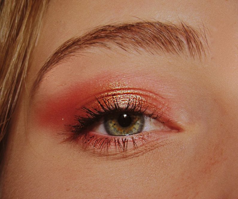 Dewy Makeup - woman with pink and gold eyeshadow makeup