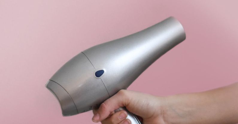 Hair Dryer - Person Holding Grey Hair Dryer